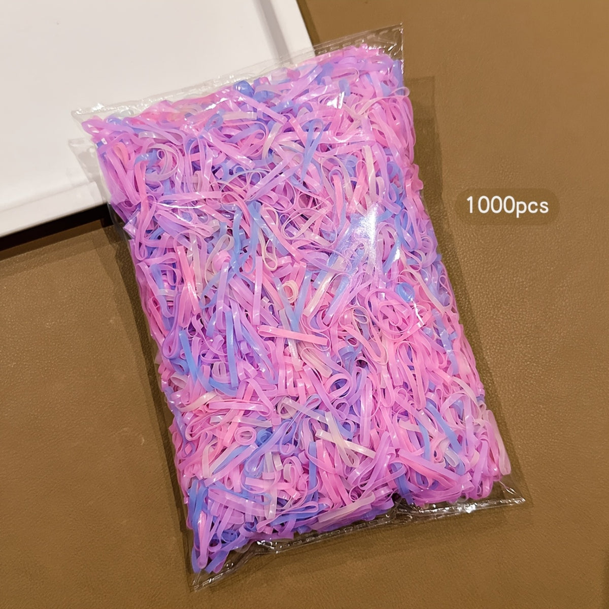 Paquete de 1,000 Ligas Pequeñas Desechables para el Cabello en Tonos Pastel (Rosa y Lila)