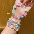 Conjunto de 4 Pulseras Infantile de Cuentas con Dijes Coloridos de Mariposas, Flores y Corazones (Estilo Pastel)