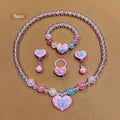 Conjunto de Joyería Infantil de 5 Piezas: Collar, Pulsera, Anillo y Aretes con Dije de Corazón Brillante y Lazo (Tonos Rosas)